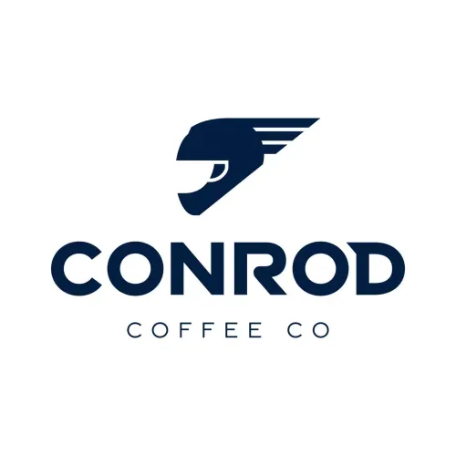 Logo of Conrod Coffee Co, featuring a stylized, dark blue helmet with speed lines. Below, bold text reads "CONROD" and smaller text reads "COFFEE CO". The design conveys speed and modernity.