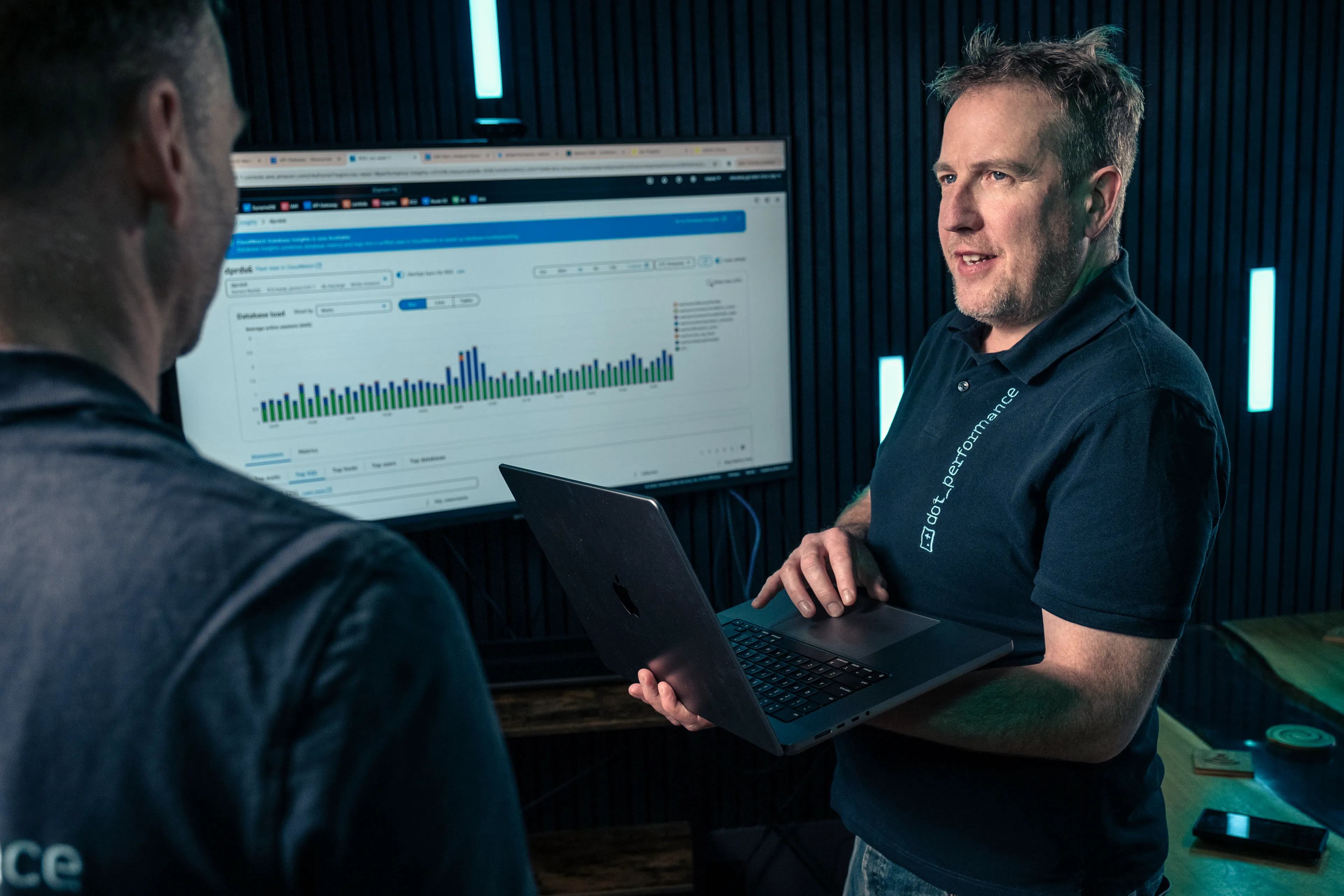 Simon Head of Digital at Dot Performance looking at analytics on laptop