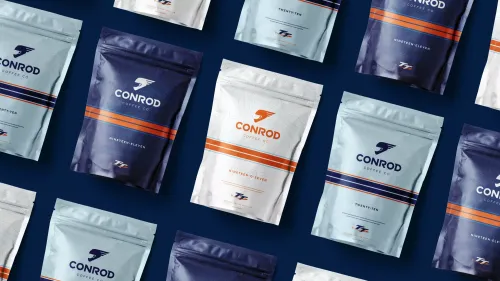 A pattern of "Conrod Coffee" bags in navy and light blue, arranged diagonally on a dark blue background; conveys a modern and stylish tone.