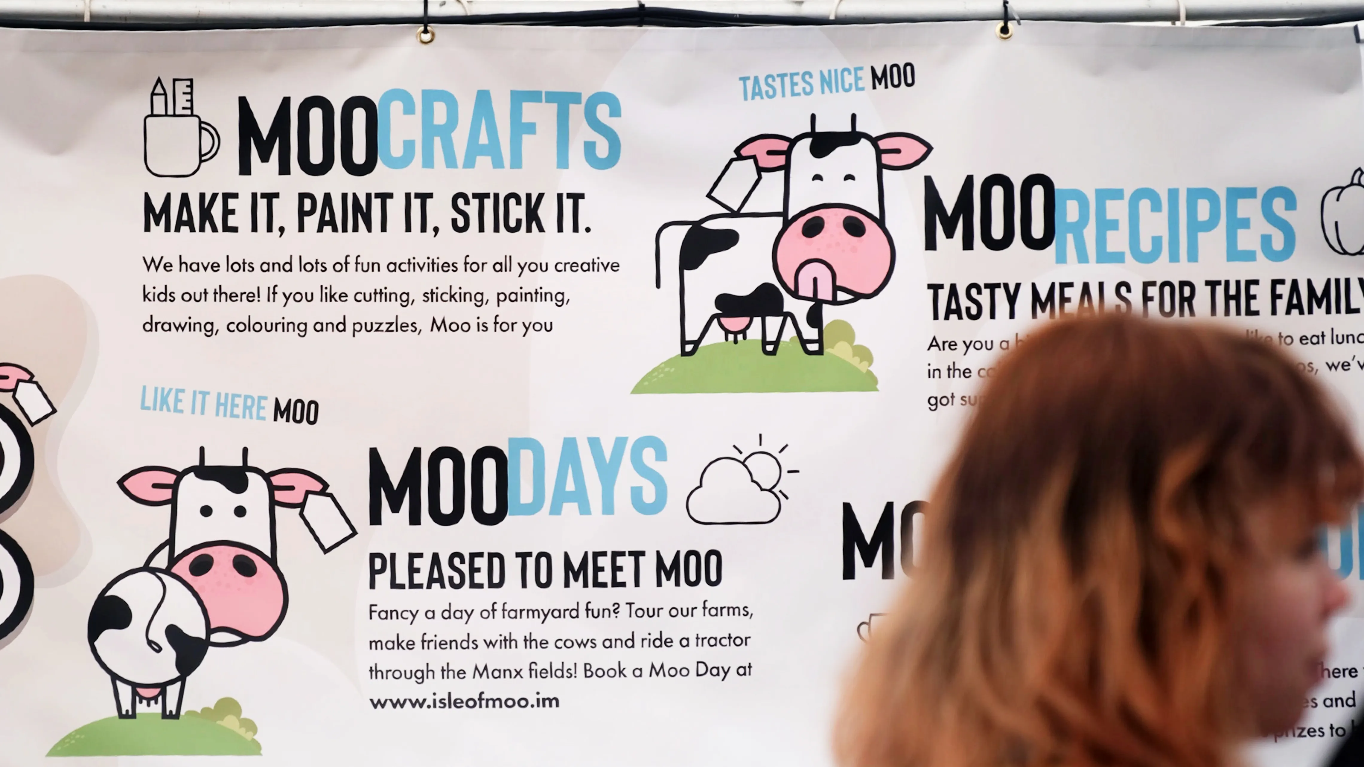 Large Isle of Moo poster promoting crafts, Moo Days and family-friendly activities with illustrated cow graphics.
